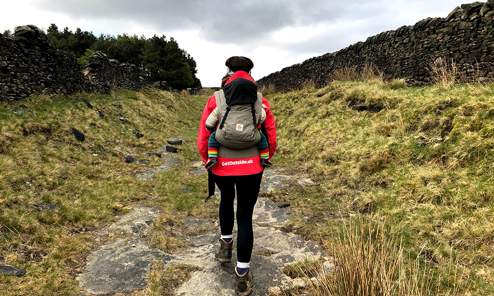 Walking with a child carrier pack