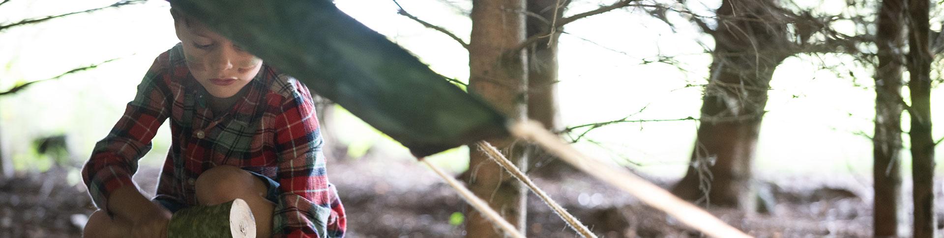 Girl looking at leaf 