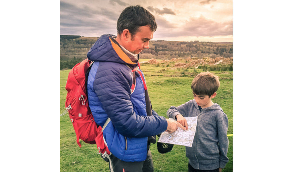 father and son map reading