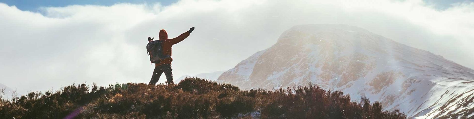 Two walkers on a hill on an autumn day
