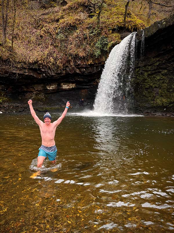 Chris Webster in a waterfall