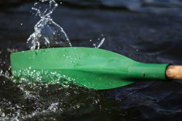 The head of an oar in the water