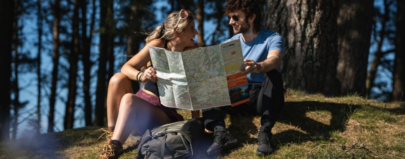 Tristan and Chloe reading a map