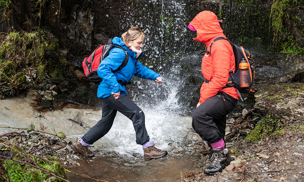 hikers crossing stream walking socks