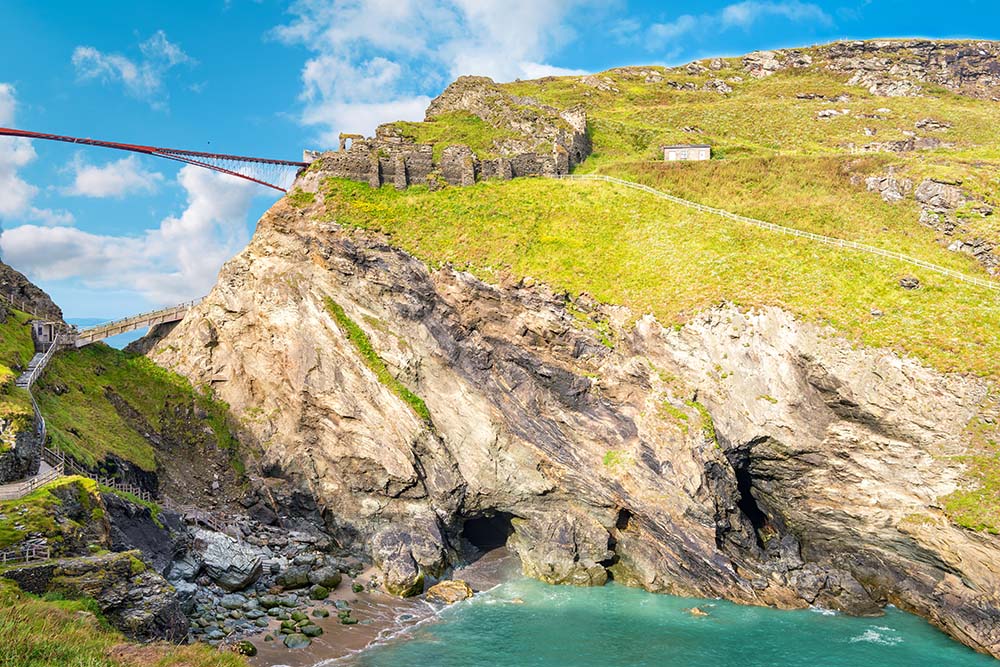 View to Tintagel island,legendary Tintagel castle ruins and Merlin's cave.