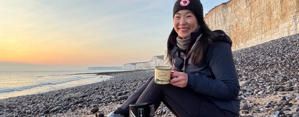 May Cheung drinking coffee on Birling Gap Walk