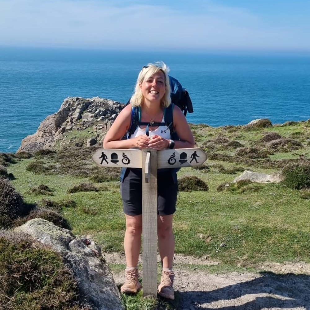 Chrissy with a national trail sign