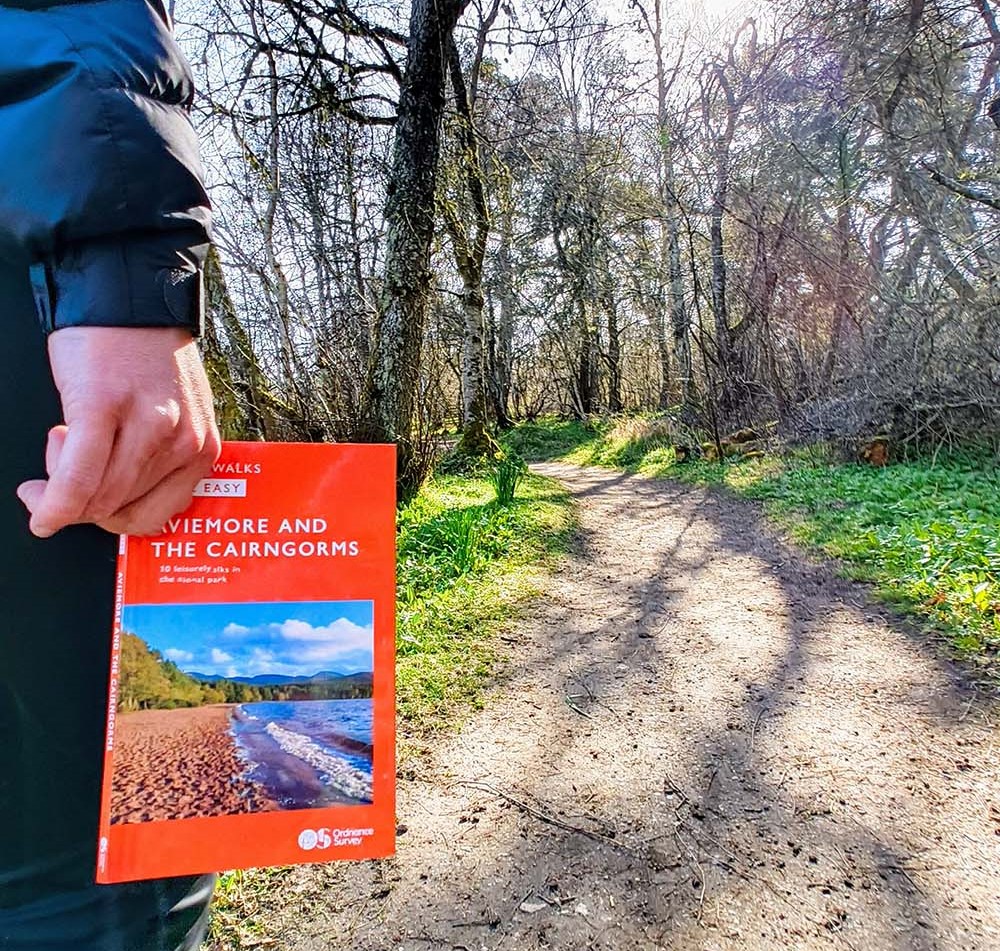 Holding a copy of Cairngorms Short Walks Made Easy