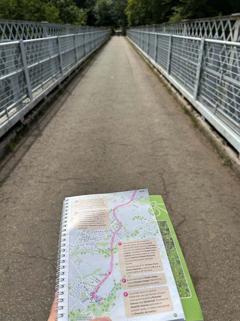 Edinburgh Cycling guidebook in foreground with Bliston Glen Viaduct