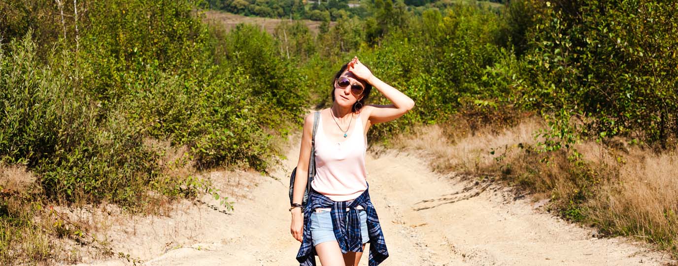Woman on a hot footpath