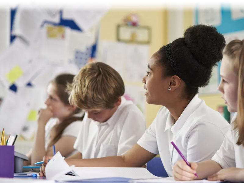 Secondary school pupils learning about maps