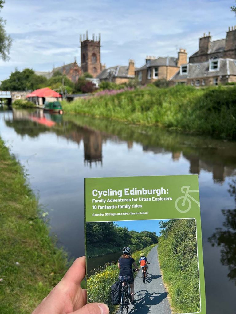 Edinburgh cycling guidebook in front of the canal