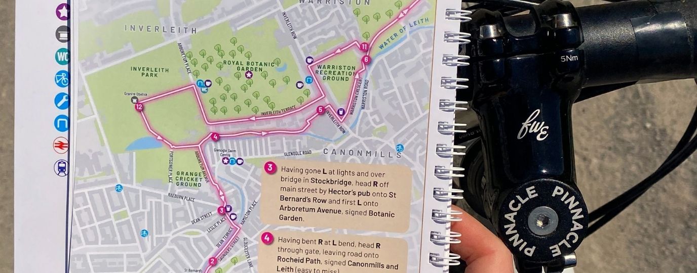 Reading Cycling Guide Book on Bike