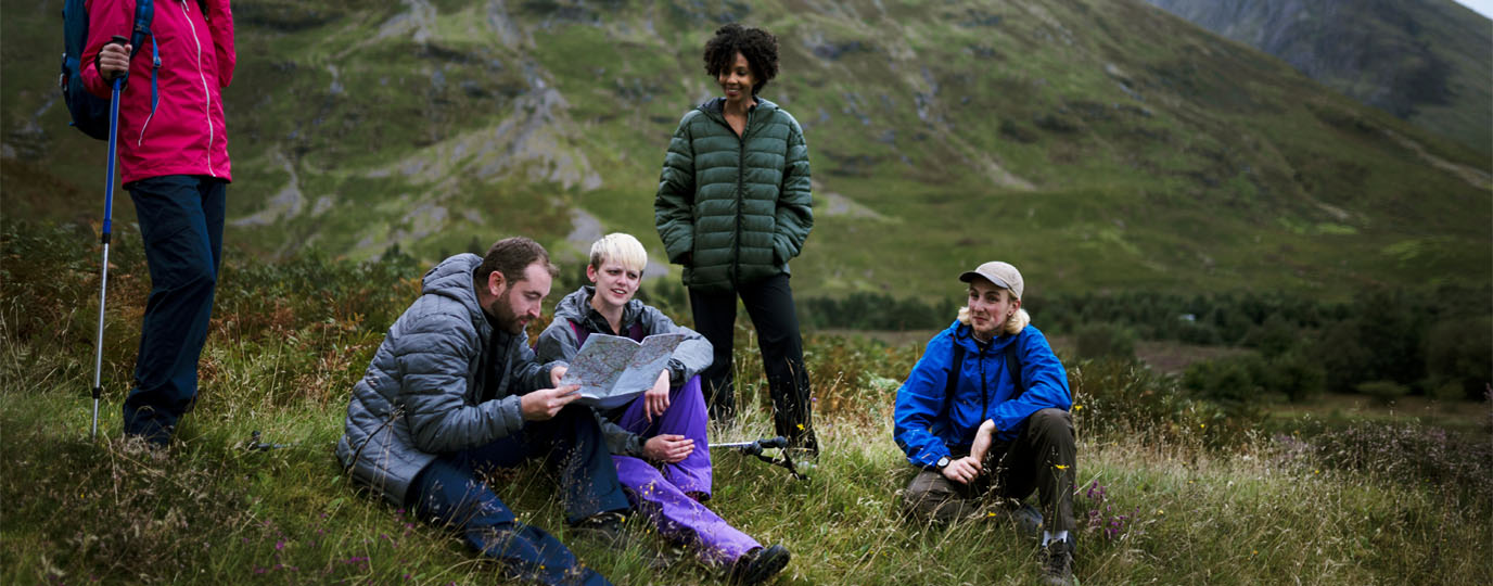Group of walkers checking the map