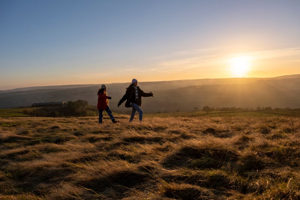 hiking with gps in the hills - girl walking