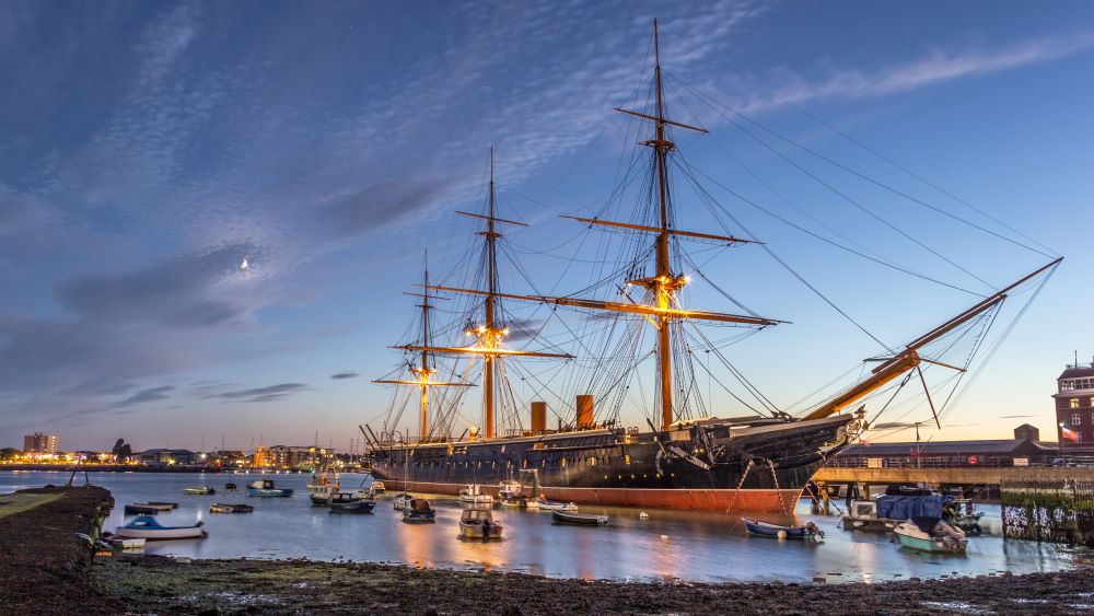 HMS Warrior, at dusk - 40-gun steam-powered armoured frigate built for the Royal Navy in 1859