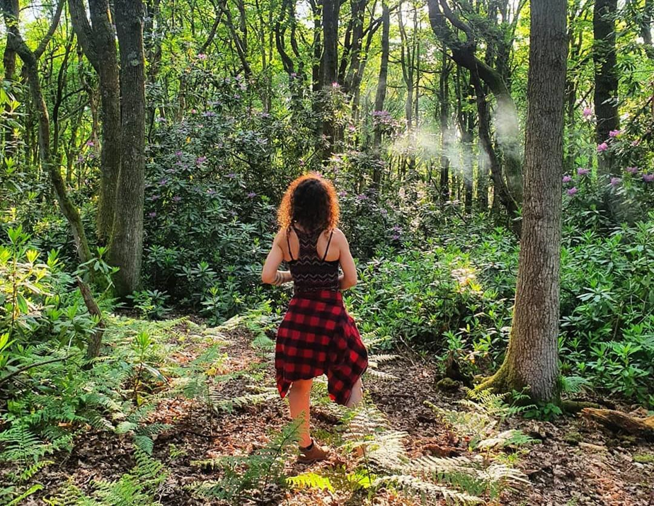 A woman looking at a forest
