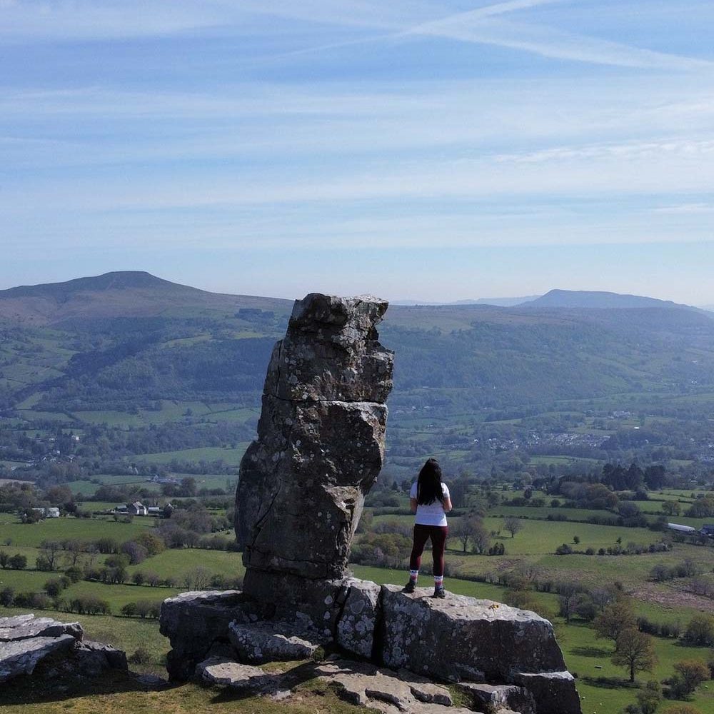 The lonely shepherd stone with a magnificent hillside view behind