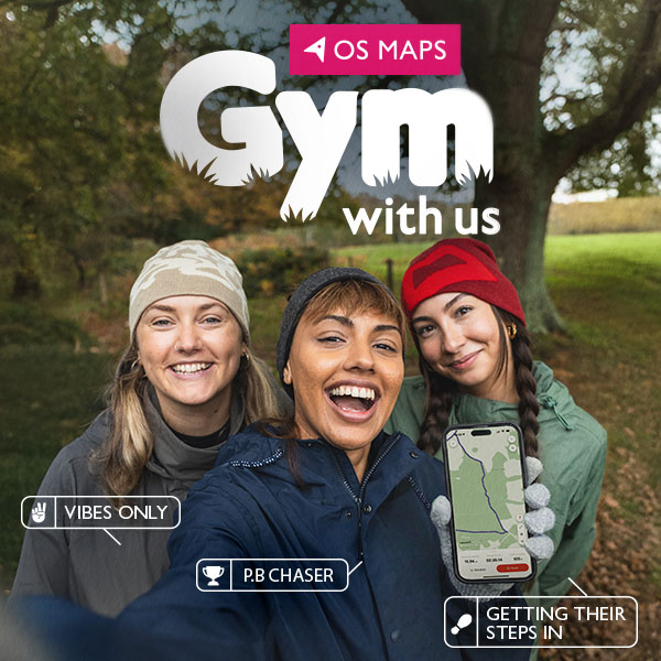 OS Maps Gym With Us. Three friends outside, show the OS Maps app on a phone