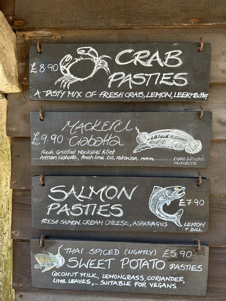 A chalk board with seafood dishes