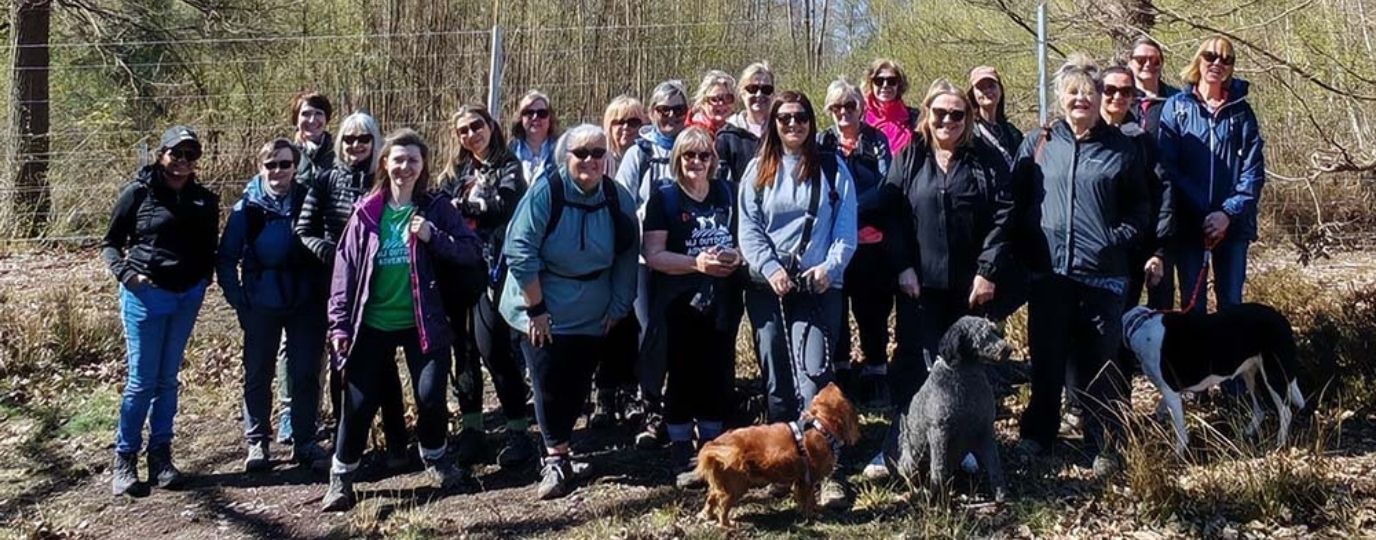 a group of women on a walk in nature