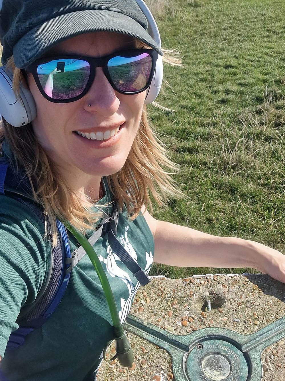 Jenn with a Trig Point