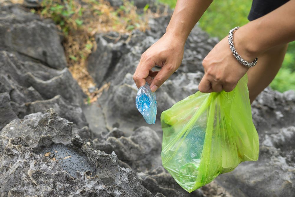 picking up litter on a hike