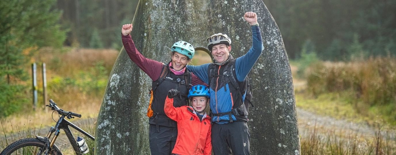 happy family with fists pumped
