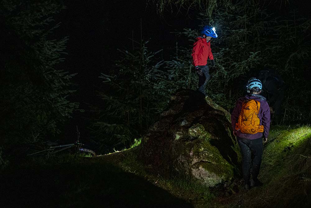 family in front of 7 stanes night time