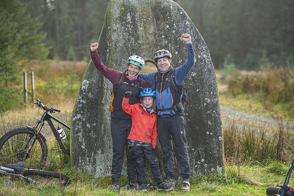 family in front of 7 stanes