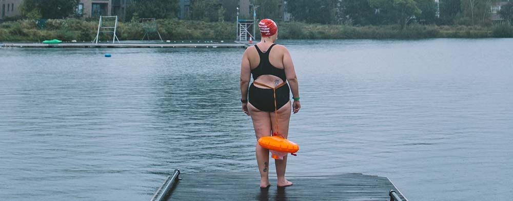 Natasha Sones by the water with a float