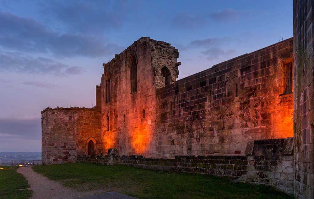 Beautiful sunset on ancient Stafford Castle with colorful sky an