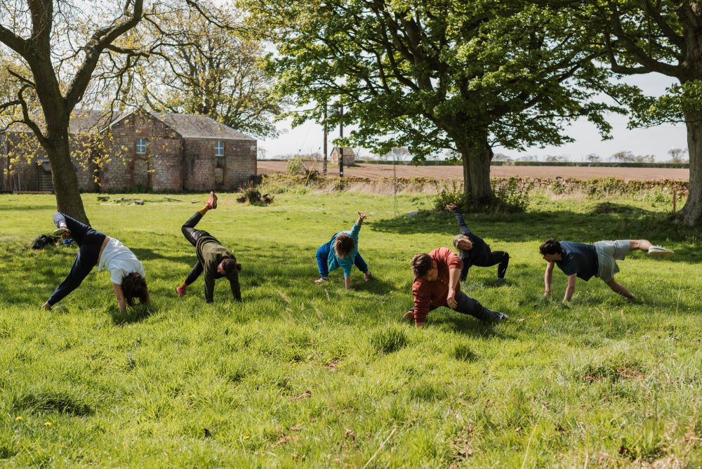 a movement class outside in a field