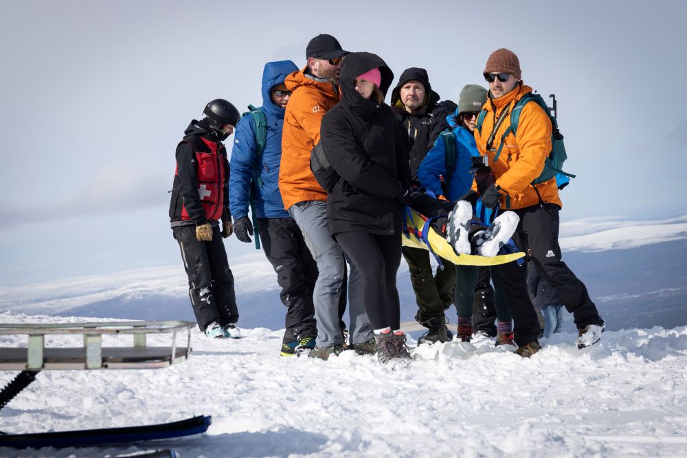 carrying an injured skiier