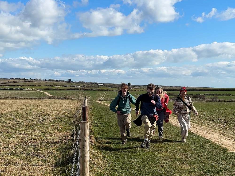 friends running outside on a hike
