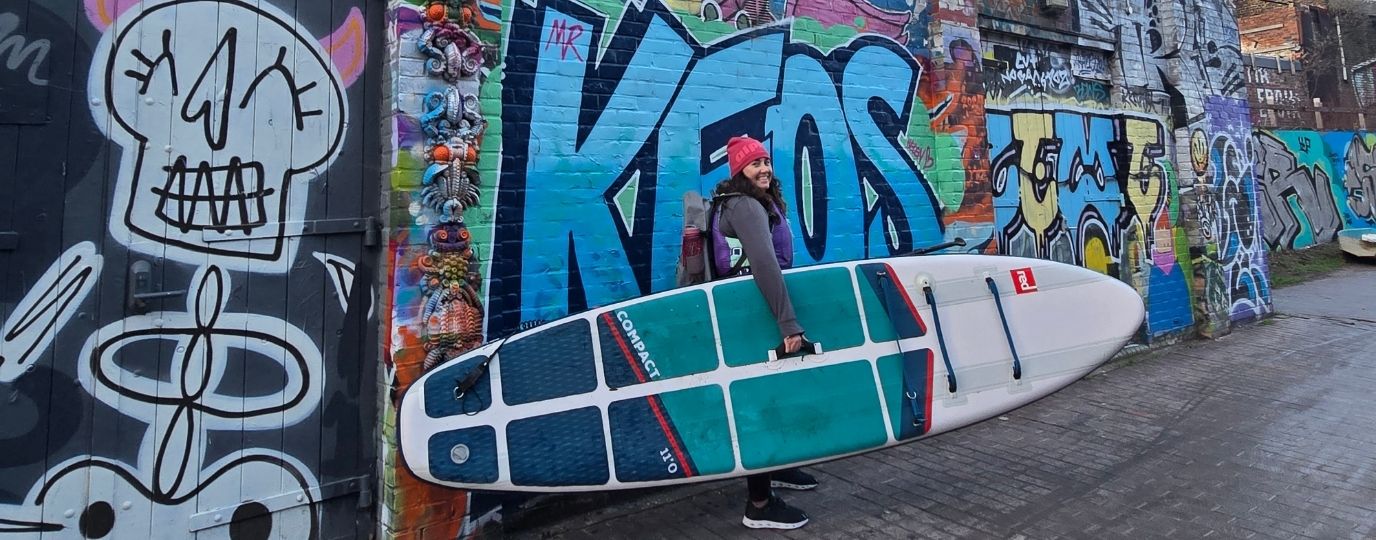paddleboarding in east london portage past graffiti