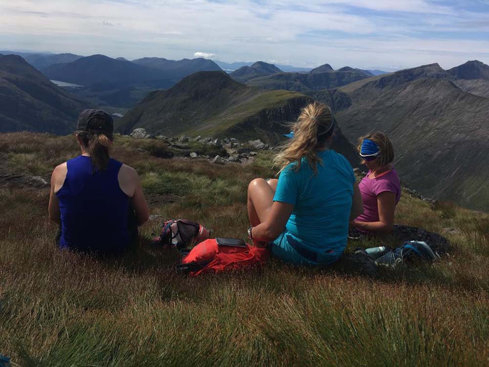 women looking into the view at mountain ranges