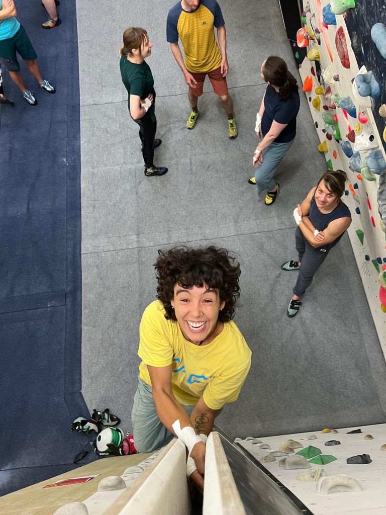 a young woman in an indoor climbing centre