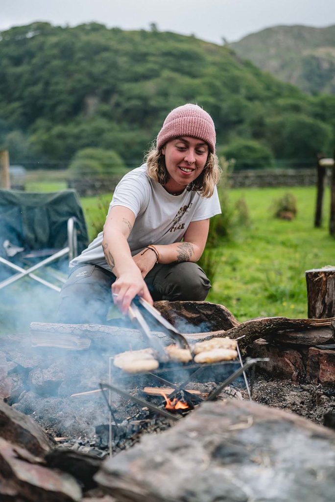 Eva Outram cooking outdoors