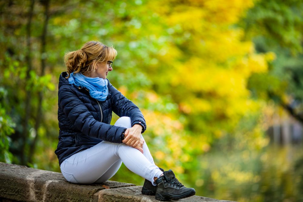 woman sat on a wall