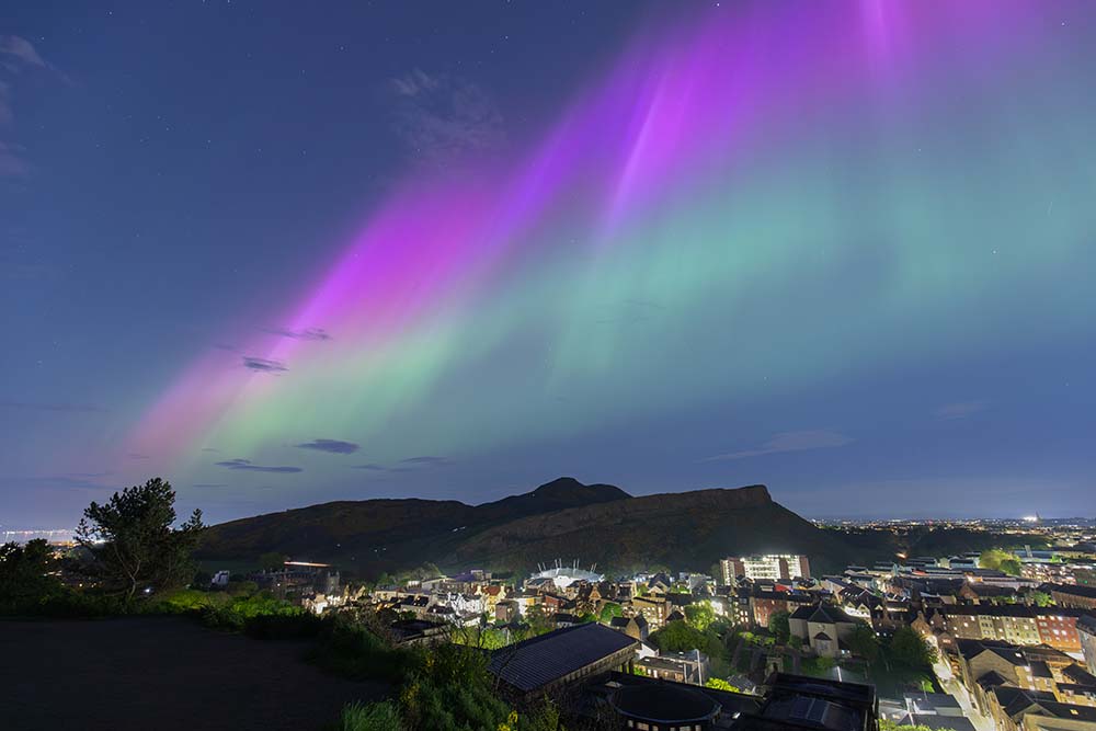 Multicoloured Aurora Borealis above Arthur’s Seat in Edinburgh