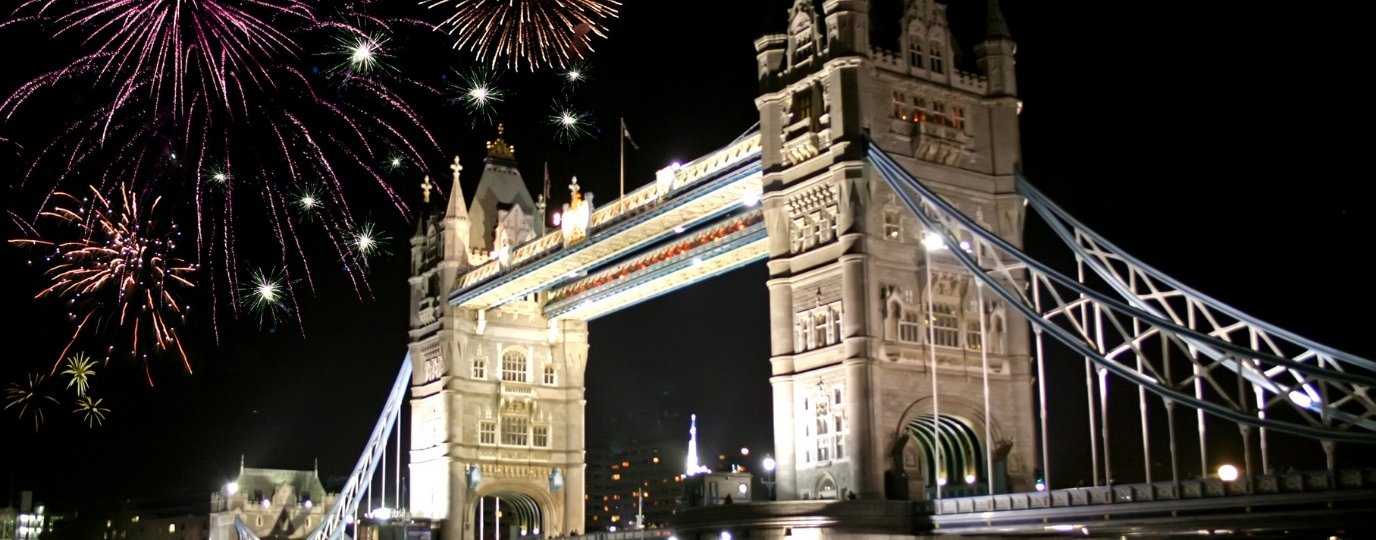 Fireworks at night over Tower Bridge in London