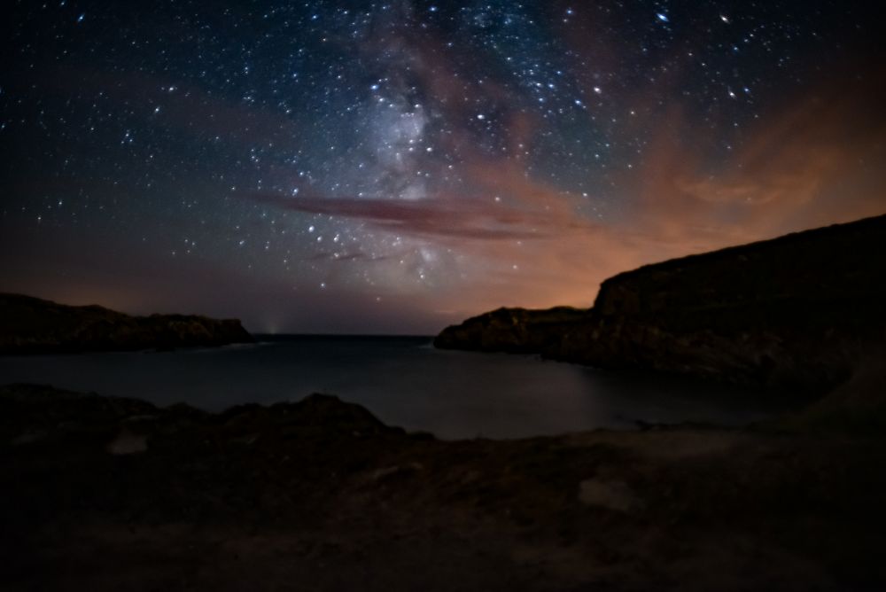 The stars of the Milky Way above a beach on Anglesey